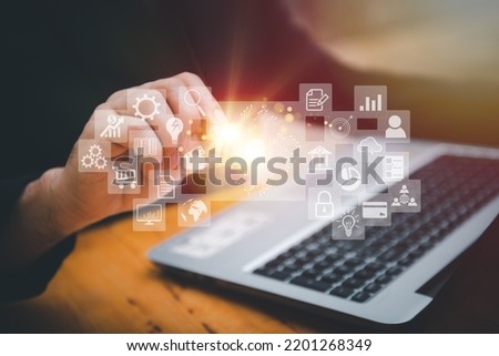 Closeup image of a business man's hands working and typing on laptop computer keyboard on office table.Business intelligence.