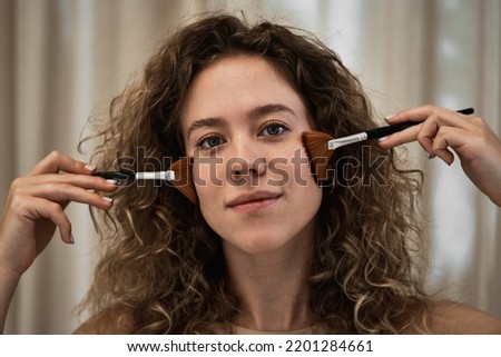Face massage with brushes. High quality photo