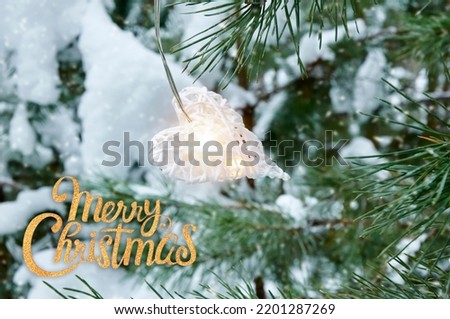 Christmas garland white hearts on fir branches in the snow. Christmas and New Year holidays background