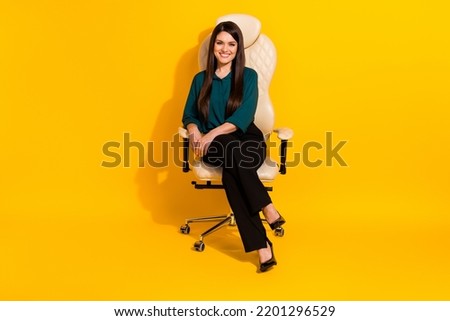 Full length photo of young cheerful woman sit stool banker financier isolated over yellow color background