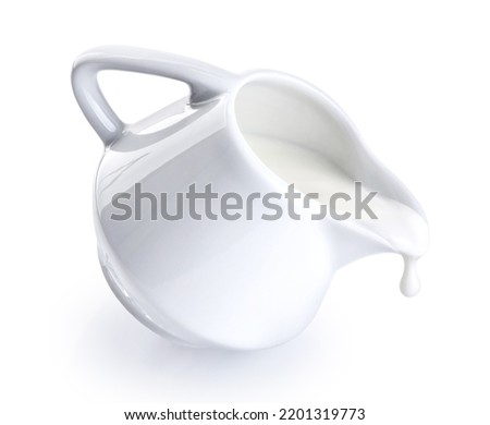  Ceramic milk jar, pot, jug isolated on white background. Milk flowing from a jug. With clipping path. Royalty-Free Stock Photo #2201319773