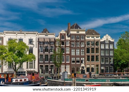 Details and facades of Amsterdam characteristic brick construction of residential building Amsterdam School style. High quality photo