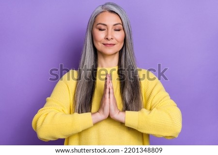 Photo of attractive positive peaceful grandma practice yoga exercises isolated on violet color background