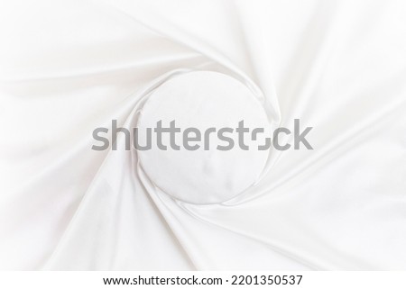 round empty space with satin radial lines, silky swirl backdrop, fabric texture