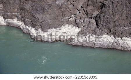 Mountain river in autumn. Turquoise color.