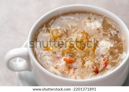 Shark fin soup (Indonesia : Soup Sirip Ikan Hiu) is a popular soup in Chinese cuisine which is usually served on special occasions such as weddings or banquets. Royalty-Free Stock Photo #2201371891