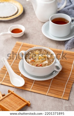 Shark fin soup (Indonesia : Soup Sirip Ikan Hiu) is a popular soup in Chinese cuisine which is usually served on special occasions such as weddings or banquets. Royalty-Free Stock Photo #2201371895