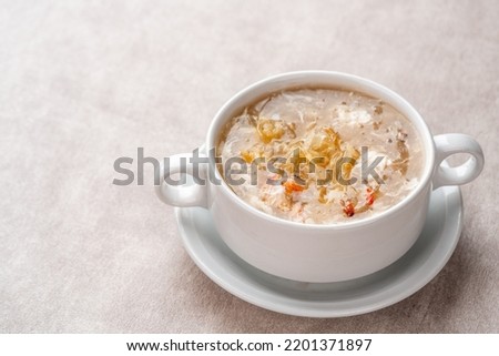 Shark fin soup (Indonesia : Soup Sirip Ikan Hiu) is a popular soup in Chinese cuisine which is usually served on special occasions such as weddings or banquets. Royalty-Free Stock Photo #2201371897