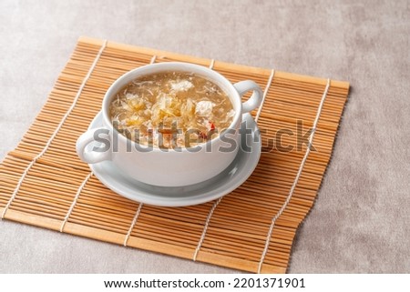 Shark fin soup (Indonesia : Soup Sirip Ikan Hiu) is a popular soup in Chinese cuisine which is usually served on special occasions such as weddings or banquets. Royalty-Free Stock Photo #2201371901