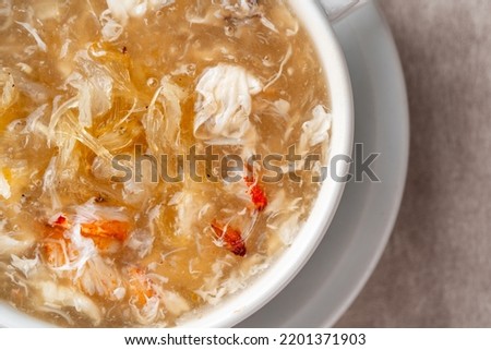 Shark fin soup (Indonesia : Soup Sirip Ikan Hiu) is a popular soup in Chinese cuisine which is usually served on special occasions such as weddings or banquets. Royalty-Free Stock Photo #2201371903
