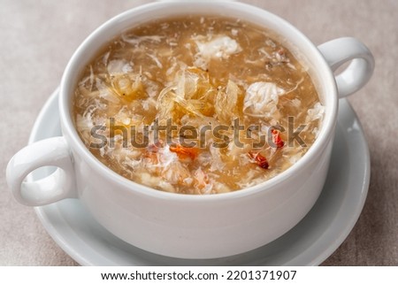 Shark fin soup (Indonesia : Soup Sirip Ikan Hiu) is a popular soup in Chinese cuisine which is usually served on special occasions such as weddings or banquets. Royalty-Free Stock Photo #2201371907