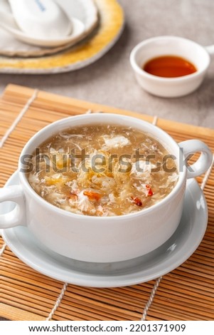 Shark fin soup (Indonesia : Soup Sirip Ikan Hiu) is a popular soup in Chinese cuisine which is usually served on special occasions such as weddings or banquets. Royalty-Free Stock Photo #2201371909