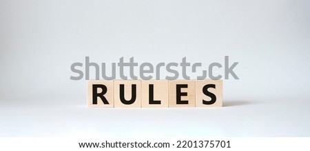 Rules symbol. Wooden cubes with word Rules. Beautiful white background. Rules concept. Copy space.