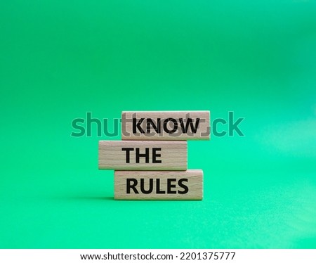 Know the rules symbol. Wooden blocks with words Know the rules. Beautiful green background. Business and Know the rules concept. Copy space.