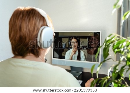 Senior adult plus size woman having online psychotherapy session with professional psychologist using computer at home. Digital service business Royalty-Free Stock Photo #2201399353