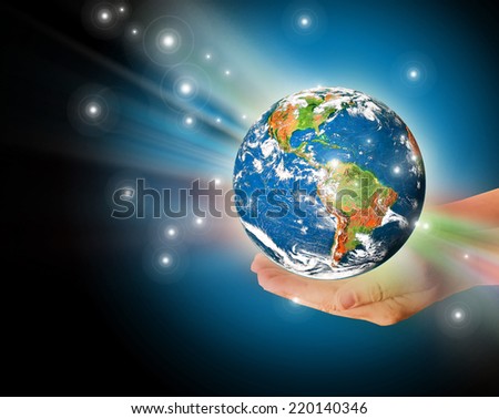 Globe on her hands, South and North America. Elements of this image furnished by NASA 