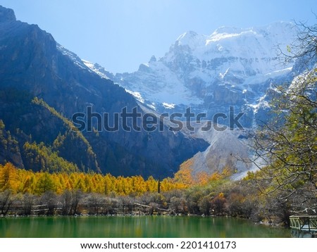Pearl Lake or Zhuoma La Lake and snow mountain in autumn in Yading Nature reserve, Sichuan, China. Beautiful nature landscape.