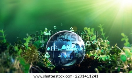 Green energy for clean and sustainable environment. Wind energy used in the industry of factories, machines and technologies. Reducing Co2 emissions and limiting global warming and climate change Royalty-Free Stock Photo #2201411241