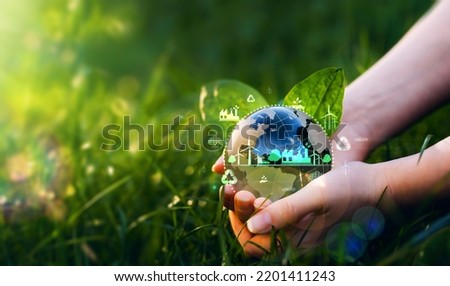 Green energy for clean and sustainable environment. Wind energy used in the industry of factories, machines and technologies. Reducing Co2 emissions and limiting global warming and climate change Royalty-Free Stock Photo #2201411243
