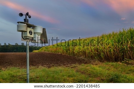 Modern and digital agriculture with a weather station when the weather is nice. Royalty-Free Stock Photo #2201438485