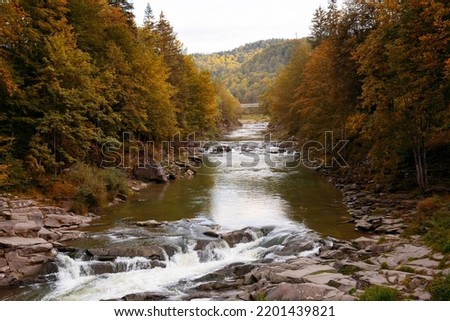 Waterfall Probiy in Yaremche and mountain view river Prut. Autumn landscape. Carpathians, Ukraine. Selective soft focus