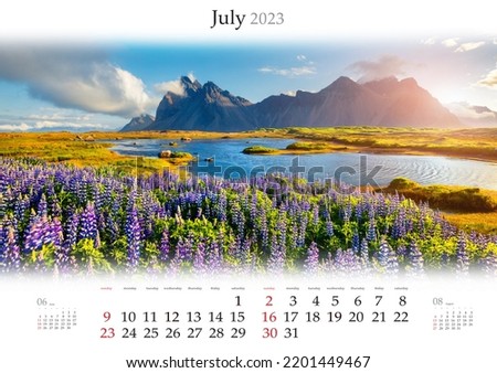 Wall calendar for 2023 year. July, B3 size. Set of calendars with amazing landscapes. Blooming lupine flowers on the Stokksnes headland, Iceland, Europe. Monthly calendar ready for print.
