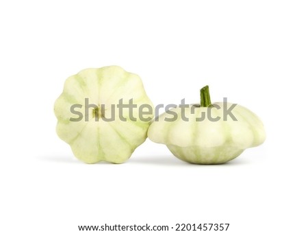Isolated scallop squash or patty pan squash. Summer squash harvest with scalloped edges. Known as cymling's, custard marrows or custard squashes. Selective focus. White background. Royalty-Free Stock Photo #2201457357