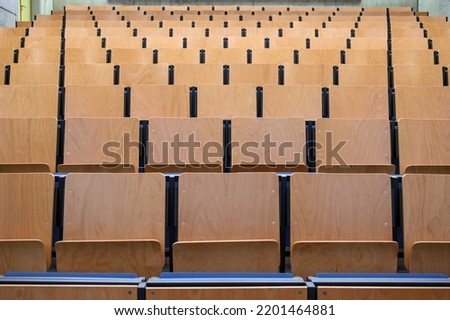 Classroom in University. Lecture room. Chairs and tables in class for studying lessons. Classroom furniture. Amphitheater. Royalty-Free Stock Photo #2201464881
