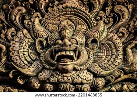 Image of Hindu God carved on wood in a Hindu temple in Bali, Indonesia. Royalty-Free Stock Photo #2201468855