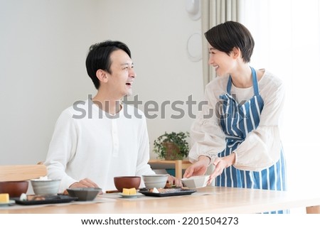 Wife preparing meals for her husband