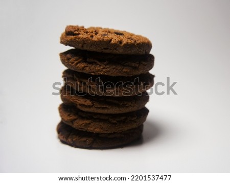 Chocolate cookies on white table with selected focus. Chocolate chip cookies shot. Good for background, cover template or cookies website. 