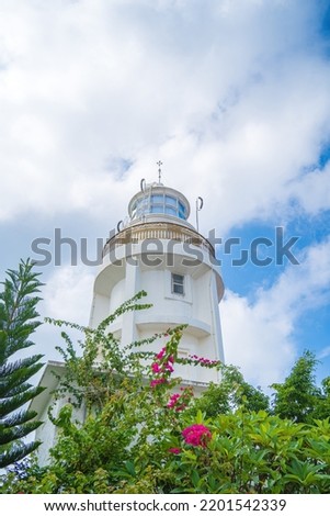 Focus white Lighthouse in Vung Tau. The most visited tourist location in the Vung Tau city and famous Lighthouse captured with blue sky and cloud.