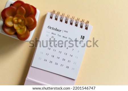 Hello October.Desktop calendar for October 2022 on a light background.