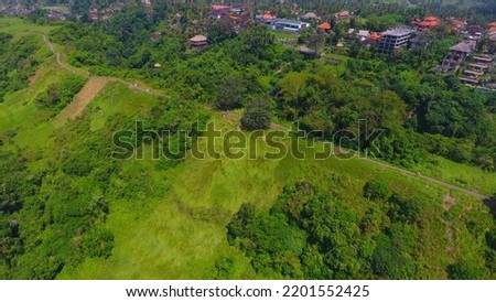 Aerial view of Campuhan Ridge Walk in Ubud, Bali. It is a beautiful walk which is filled with greenery and hills. It's more of a jungle or forest walk Royalty-Free Stock Photo #2201552425