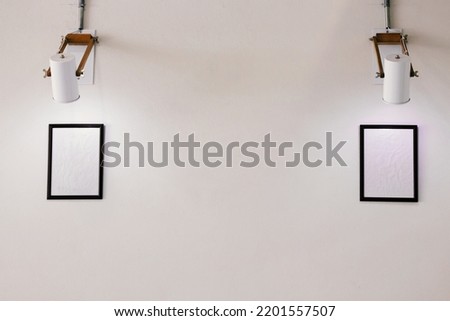 Simply picture frame on white wall, stock photo