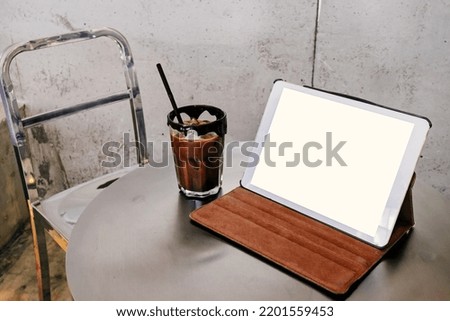 Mobile working in coffee shop with table, stock photo