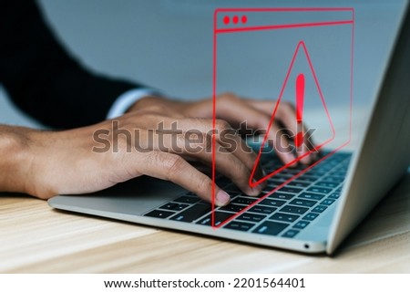 Antivirus. business people hand using laptop computer with virtual malware attack warning graphic icon on desk, virus protection software, cyber, business finance, internet network technology concept