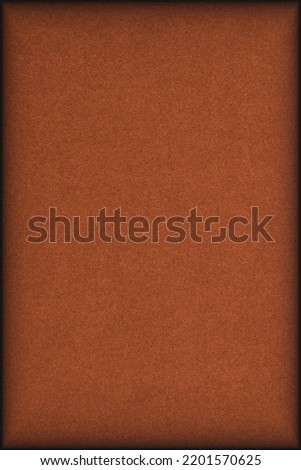 Dark orange colored paper texture. Bright brown tinted background. Vertical backdrop with vignetting. Textured surface, fibers and irregularities are visible. Top-down