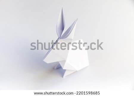 Paper rabbit origami isolated on a blank white background.