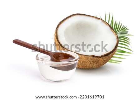 Cold pressed extra virgin coconut oil in glass bowl isolated on white background.  Royalty-Free Stock Photo #2201619701