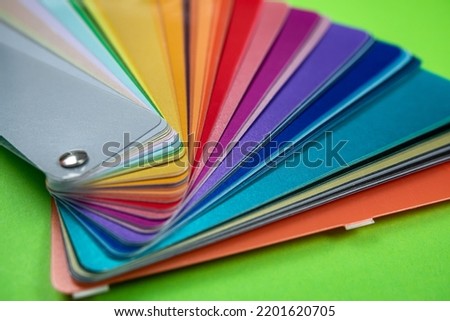 new beautiful Colorful sample placed on a wooden table close-up. isolated designs and samples. colored fans