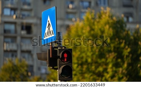 Pedestrian traffic light sign in red color showing that you are not allowed to cross the street. Public transportation industry.