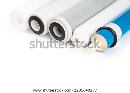 filter cartridges for water on a bright blue background. Installation of reverse osmosis water purification system. Royalty-Free Stock Photo #2201648297