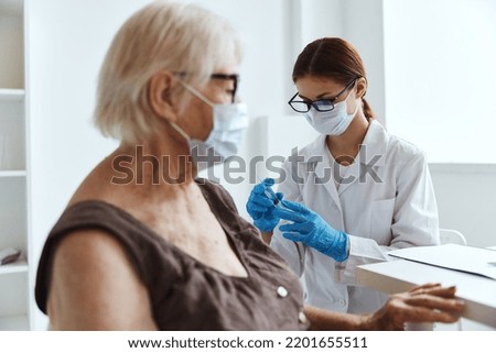 nurse in white coat shoulder injection immunization safety vaccine passport