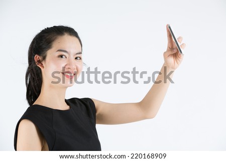 Young asian lady taking a selfie