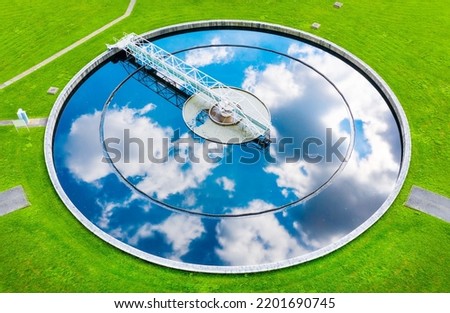 Aerial view to sewage treatment plant. Grey water recycling. Waste management theme. Ecology and environment in European Union. Royalty-Free Stock Photo #2201690745
