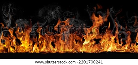 A beautiful image of fire in the dark. Abstract fire on black background Royalty-Free Stock Photo #2201700241