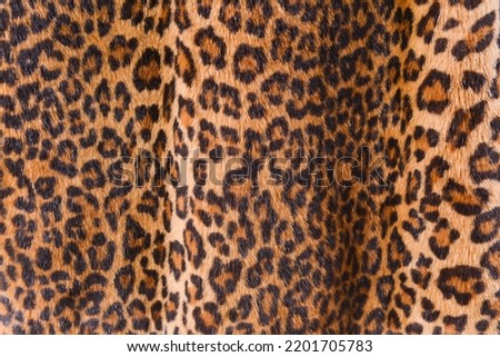 Leopard print. seamless pattern. Animal skin background with black and brown spots on beige backdrop