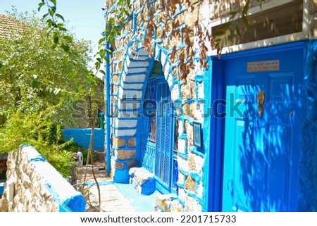 Translation of the sign on the door: G-d from heaven looked down on men, to see there is G-d
A beautiful blue ancient building in the alleys of the city of Safed in Israel the old city, safed israel Royalty-Free Stock Photo #2201715733
