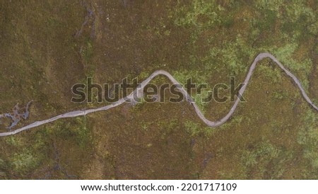Drone shot of the West Highland Way in Scotland. Topview. Meandering road. High quality photo